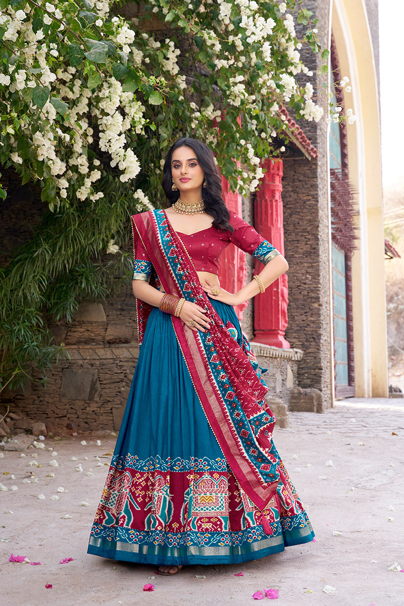 Firozi & Red Tussar Silk Sophisticated Foil Work Border Kalamkari Lehenga Choli