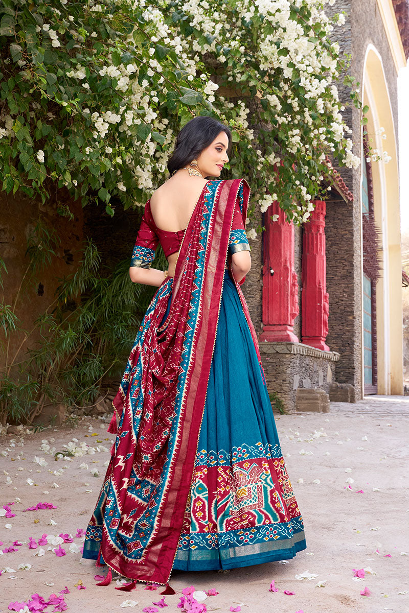 Firozi & Red Tussar Silk Sophisticated Foil Work Border Kalamkari Lehenga Choli