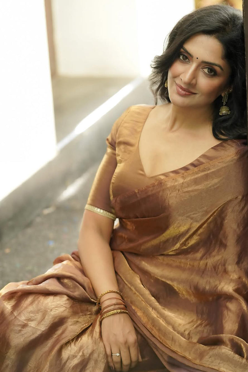 Prominent Brown Fancy Fandy Teby Silk Saree With Stitched Blouse Piece